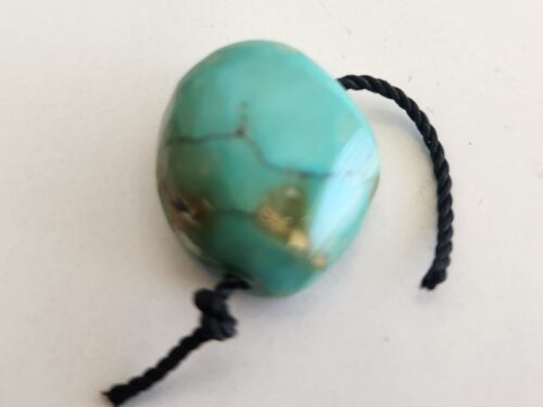 Rare 28 carat Tibetan turquoise bead with black string attachment, natural gemstone specimen for jewelry and collectors חרוז טורקיז טיבטי נדיר 28 קארט עם חוט שחור, אבן חן טבעית לתכשיטים ולאספנים